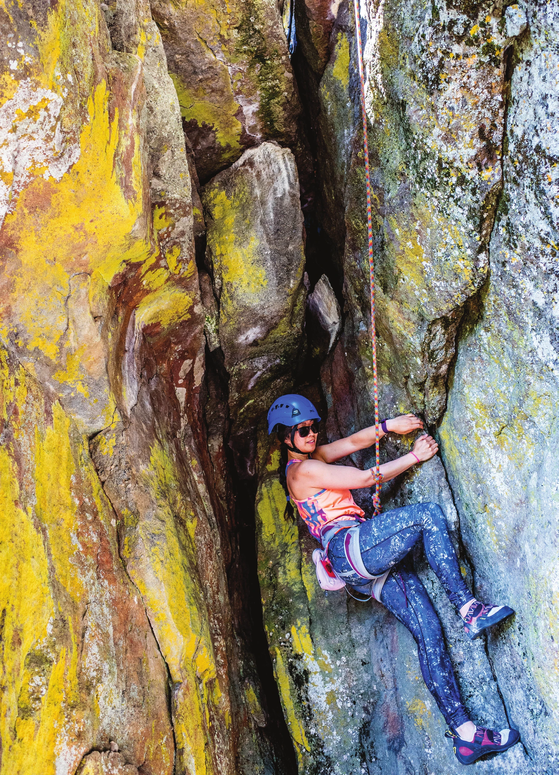 Cover of the Top Rope Rock Climbing Leader Field Handbook, showing a climber on steep orange and yellow rock
